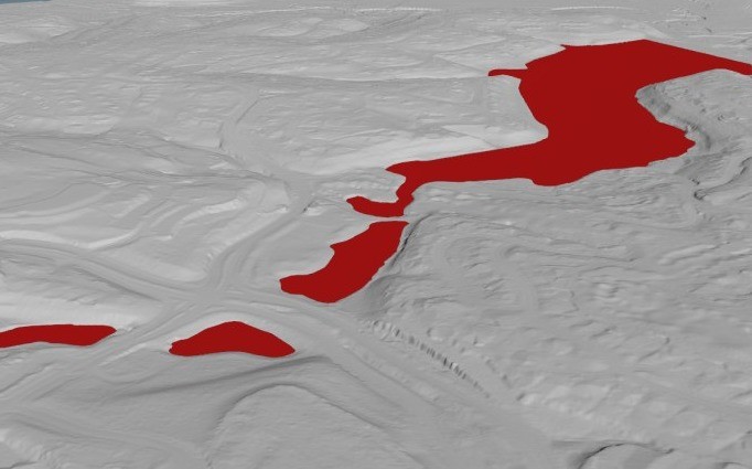 Inland terrain with a lake marked in red.